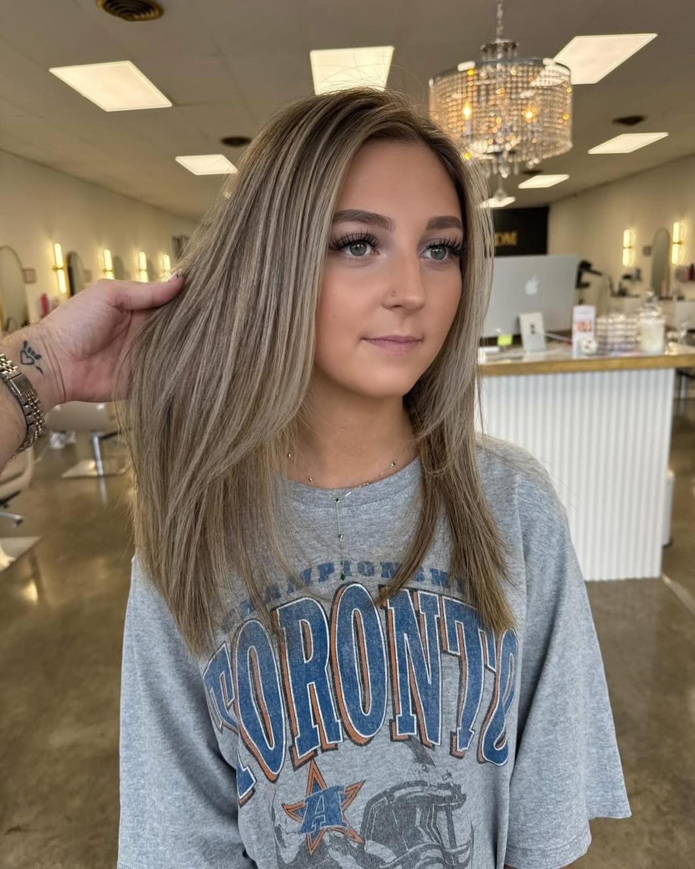 Sleek ash blonde with face-framing layers