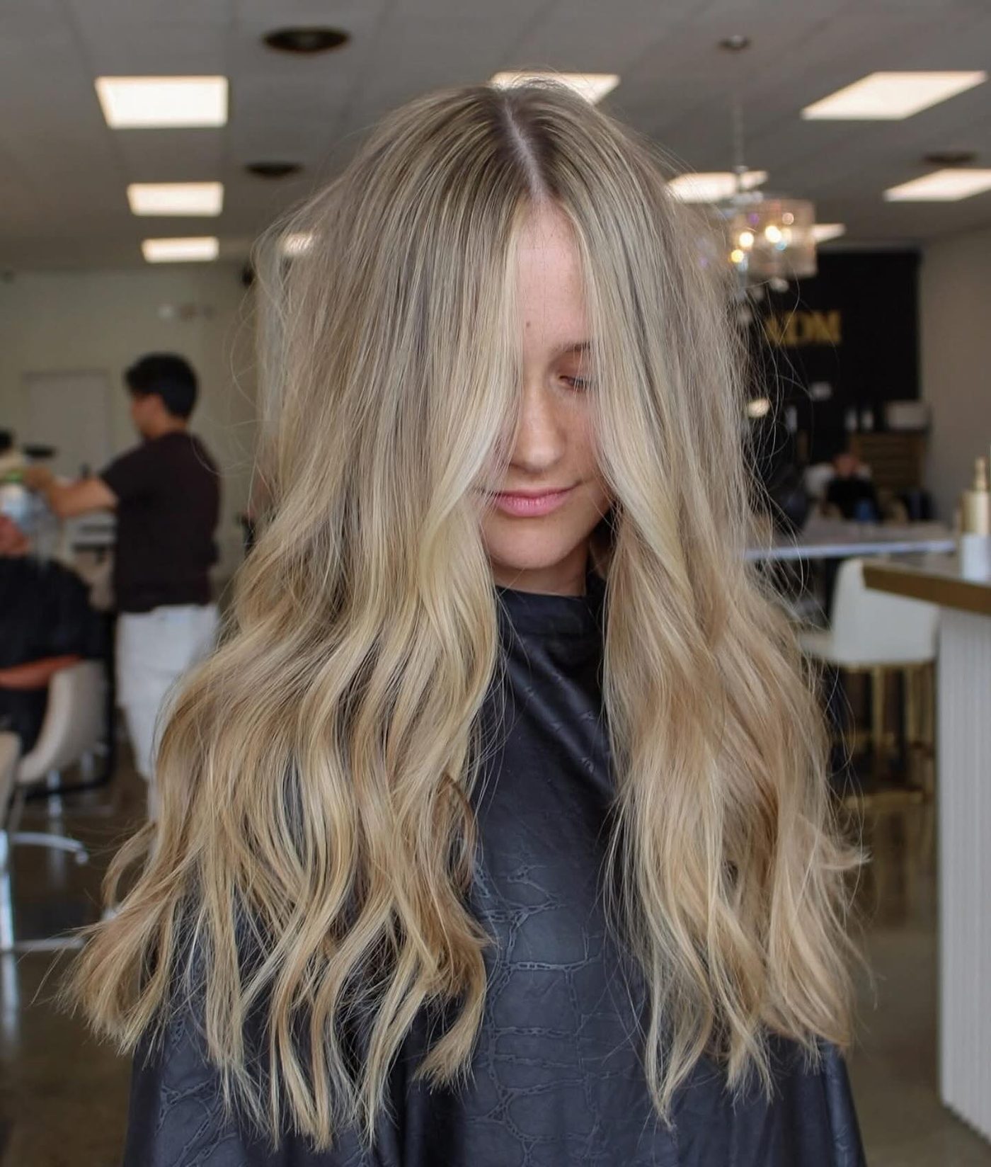 Long blonde layers with lived-in root