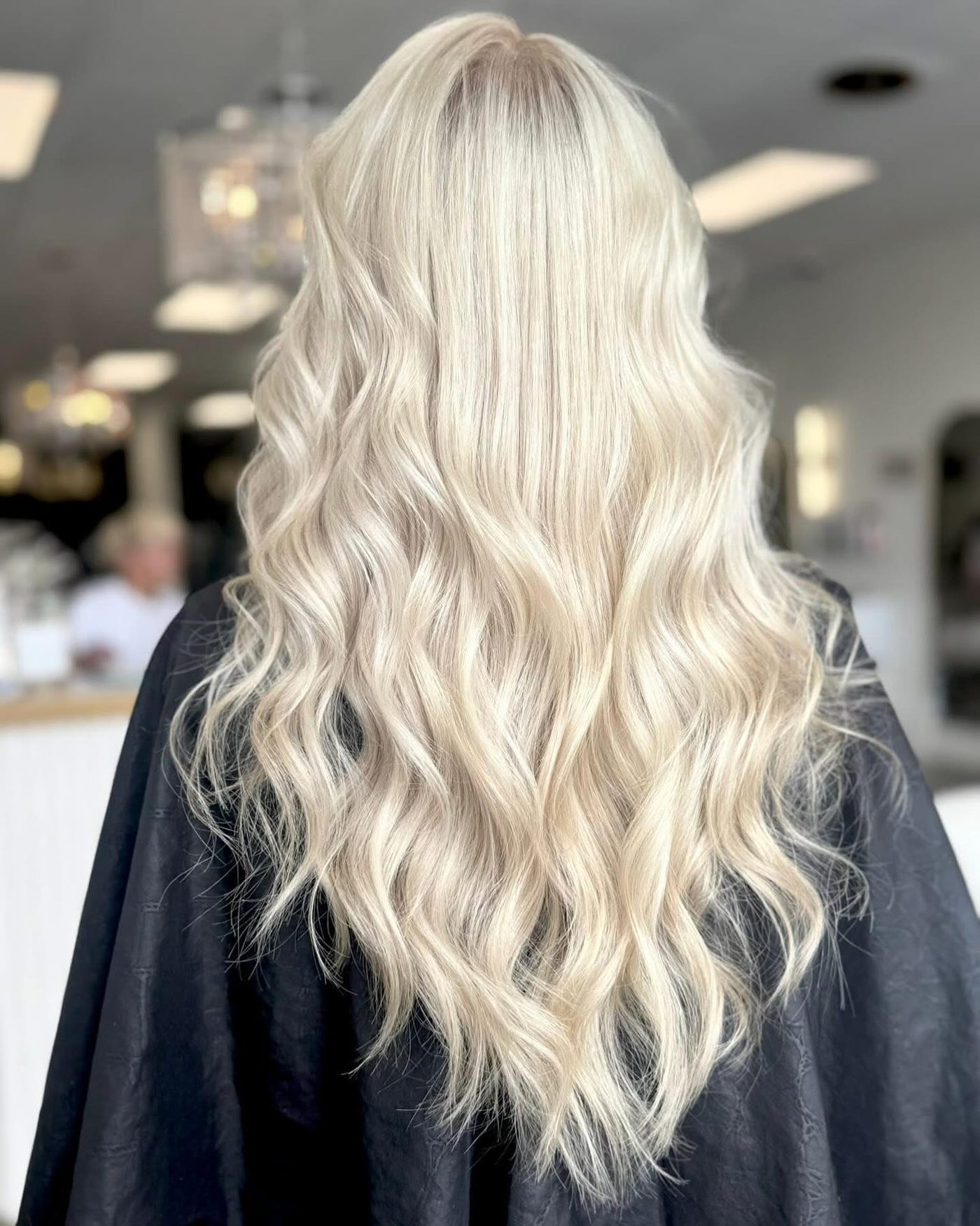 Long platinum blonde waves, back view