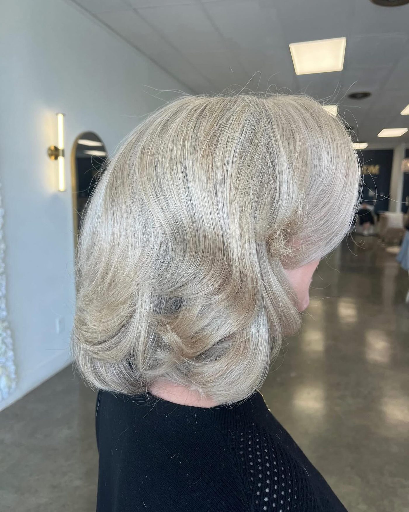 Polished silver-blonde bob with soft curl