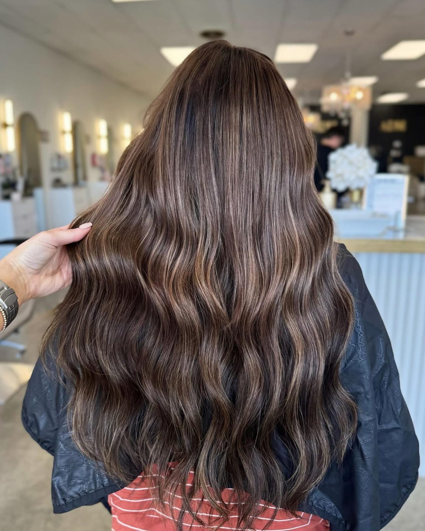 Toffee balayage on long brunette hair, back view