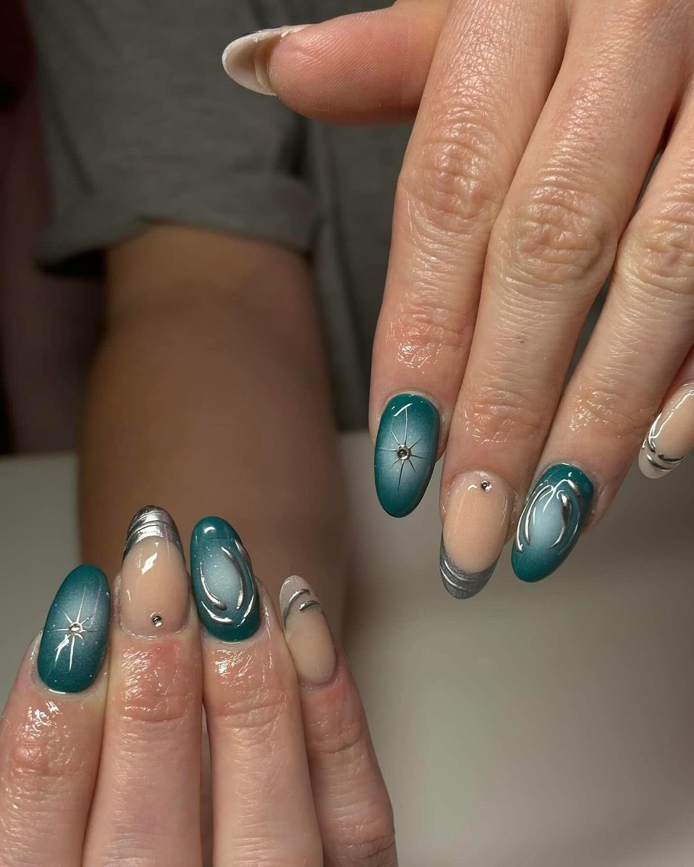 Teal aura and chrome nail designs