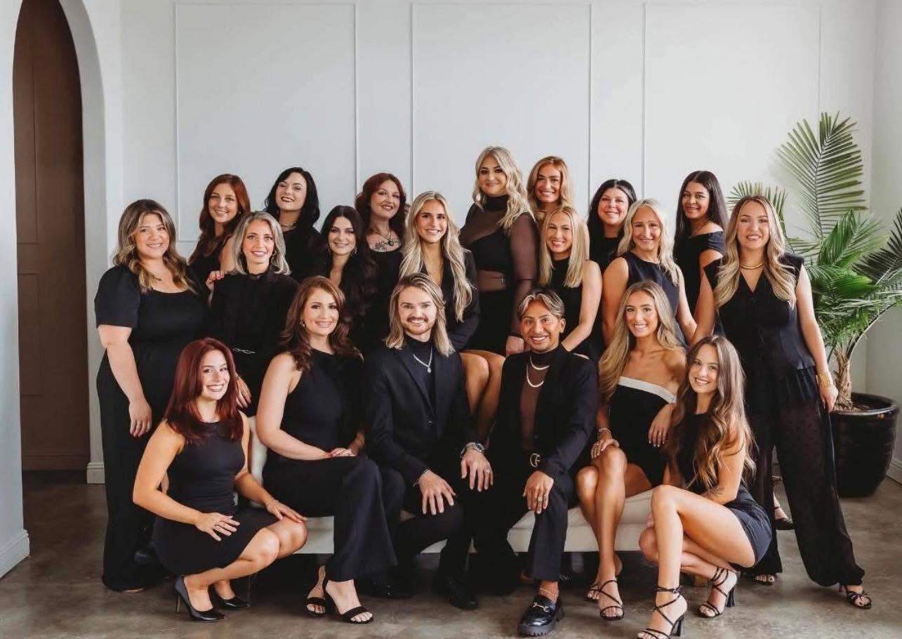 The full ADM Hair Studio and Spa team of stylists and owners in the salon